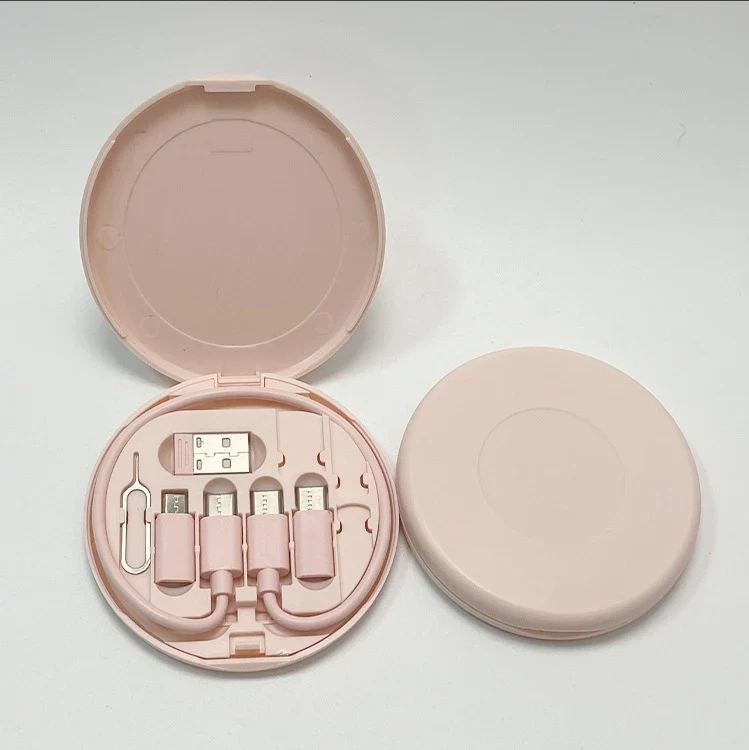 6-in-1 Travel USB Charging Cable Kit in a round pink case with multiple USB connectors.